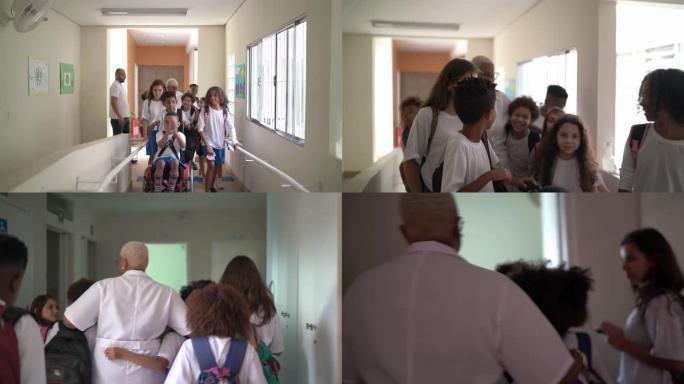 小学生走在学校走廊上，在学校拥抱老师