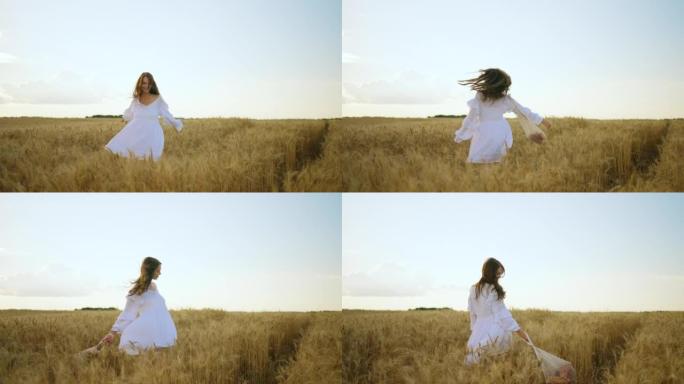 开朗的年轻女士在夏天或秋天独自走在金色的麦田上，享受大自然
