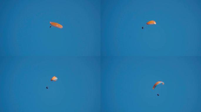 蓝天中的滑翔伞。在印度喜马al尔邦Manali的滑翔伞上飞行的运动员。夏季在马纳利的冒险活动。