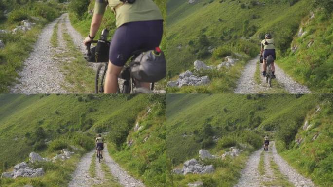 年轻人在山里的小路上骑自行车