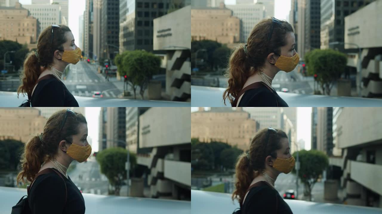 在洛杉矶市中心花街对面的人行天桥上，女人的手持镜头