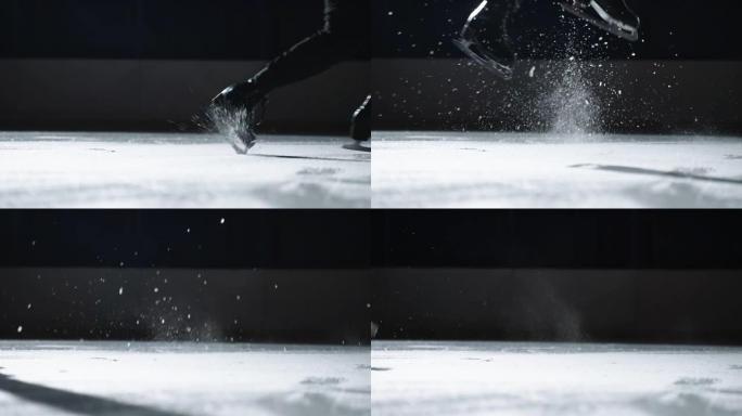 一个男人的特写镜头在溜冰鞋上向后跳。跳上溜冰鞋后，冰火花飞出。