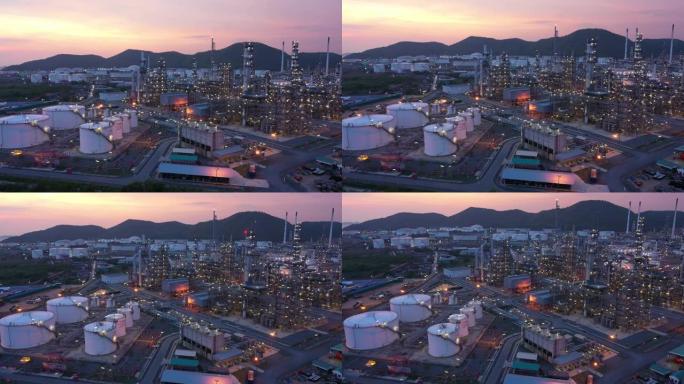 黄昏时炼油厂和油箱的鸟瞰图。商业和石化厂，储油罐以及黄昏时期的能源和钢管