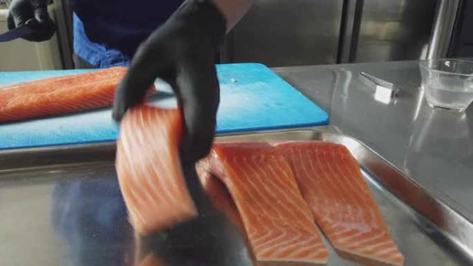 厨师准备鲑鱼的细节照片