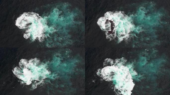 空中射击。海洋水域中的火山石礁。海浪击中他，形成白色泡沫。加拉奇科、特内里费、加那利群岛。孤独的概念