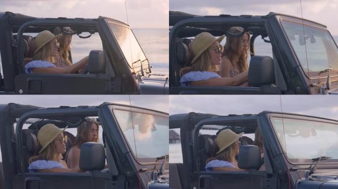 女性朋友逃到田园诗般的海滩。透过越野车窗户看。田园诗般的日落
