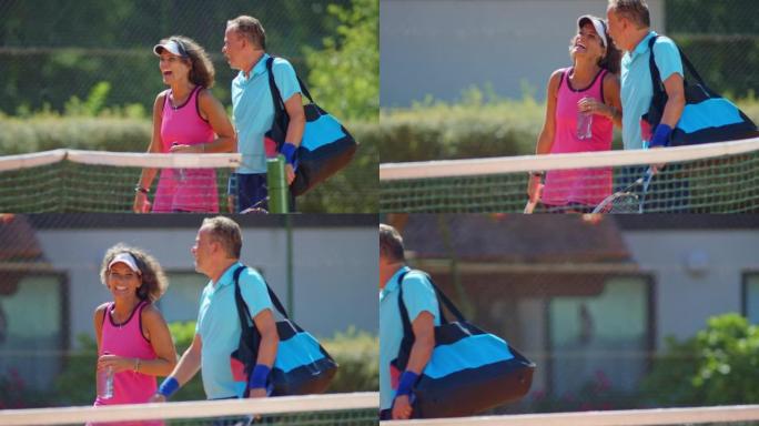 SLO MO TS中年夫妇在阳光明媚的网球场上漫步时会说话和大笑