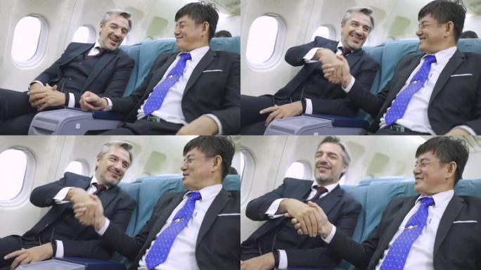 成熟的商业伙伴在飞行中相互握手