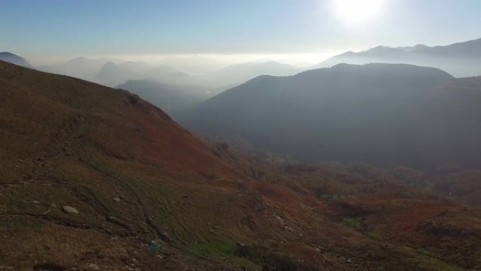 空中无人机拍摄日出后低云的山景