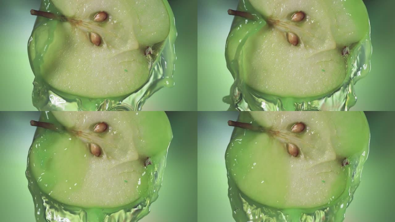 来自半个苹果的流动青苹果汁，慢动作拍摄