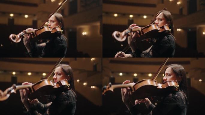 女小提琴手在音乐厅独奏，歌剧院现场有才华的女音乐家的肖像