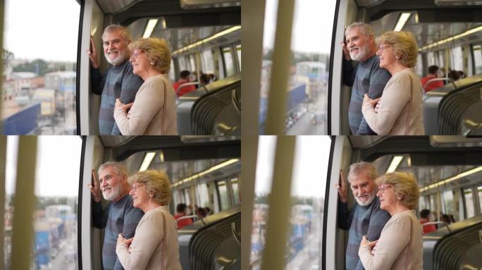 沉思的高级夫妇在地铁列车上看着窗户