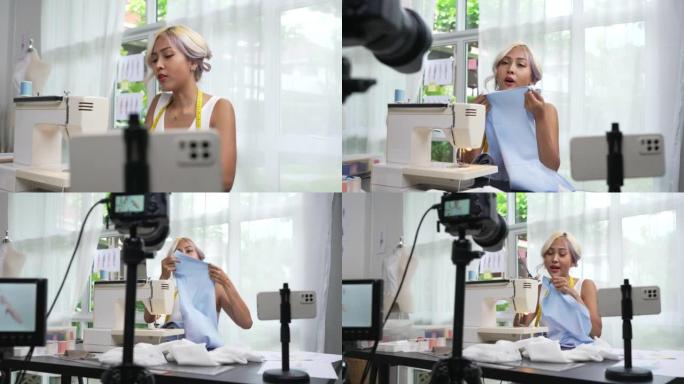 亚洲女性时装设计师，有影响力的人，博客作者或vlogger使用相机进行直播。社交媒体概念上的商业在线