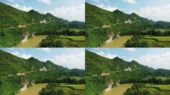 RC4殖民之路在绿油油的山间稻田里，亚洲、北越、曹邦，走向郎山，在夏天的一个阳光明媚的日子。