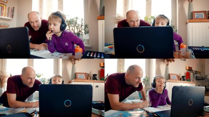 远程学习，男孩和爸爸看着电脑屏幕