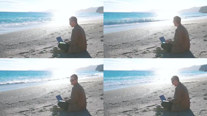 年轻的数字游牧民族在海滩上工作，使用笔记本电脑和智能手机