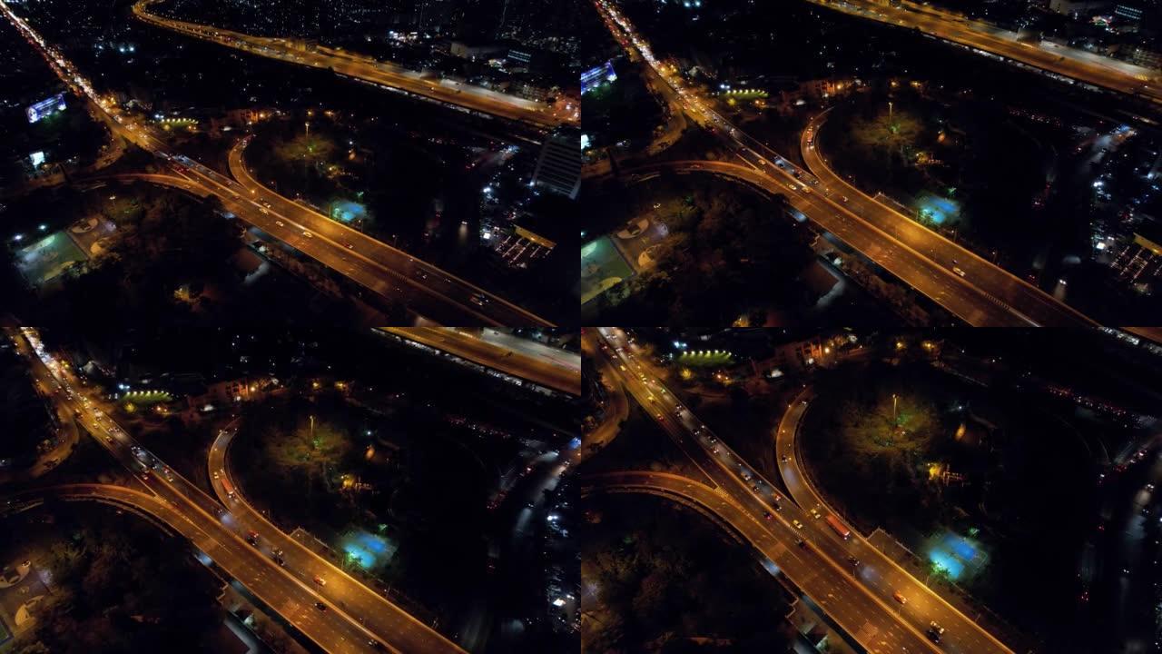 亚洲城市环岛公路上方汽车交通运输的超限延时。无人机鸟瞰图绕圈飞行。