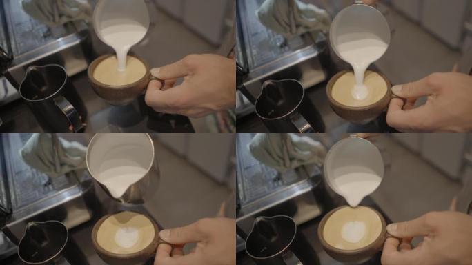 咖啡师在咖啡中倒牛奶的特写镜头