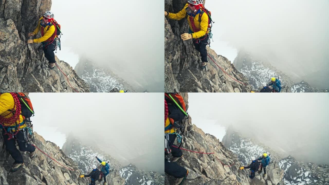 专业登山者在欧洲阿尔卑斯山攀登尖峰。用绳子。鸟瞰图