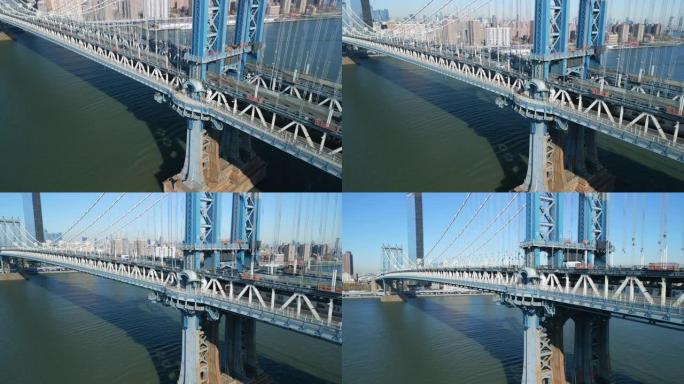 曼哈顿大桥支撑钢柱的空中下降镜头。东河上的公路和铁路桥梁。美国纽约市