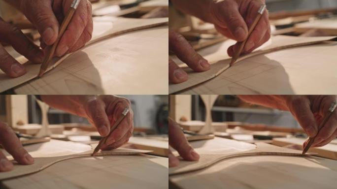 SLO MO Carpenter的手拿着一支铅笔，在木头上勾勒出一个形状