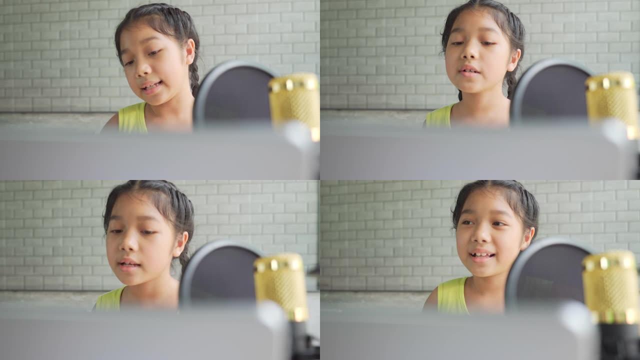 女孩在家庭录音棚唱歌。