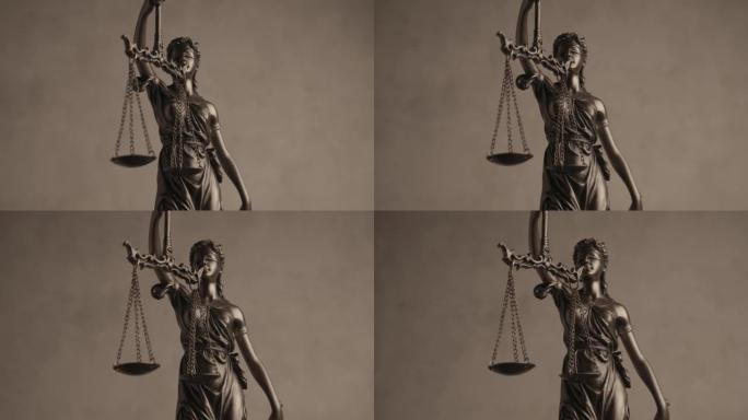 以蒙眼剪影为代表的法律概念，以旋转和保持平衡的青铜法律雕像为代表，象征着公正性和两大法律渊源