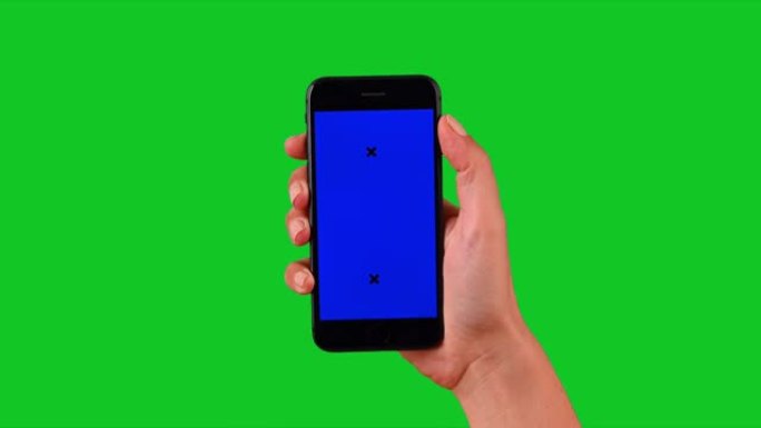 4k手使用智能手机在绿屏上显示色度键
