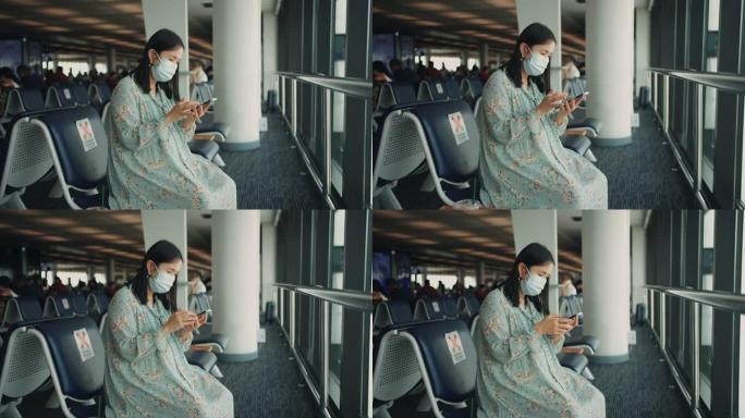 女乘客在等待新的旅程时玩着智能手机。