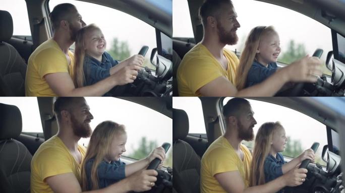 快乐父亲亲吻笑小女儿模仿骑方向盘的头的侧视图。可爱的高加索大胡子男人和车里漂亮开朗的女孩一起享受休闲