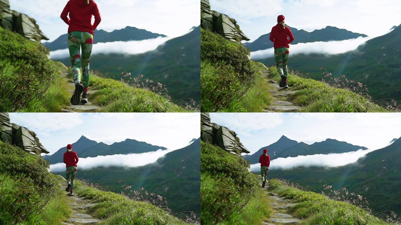 山地慢跑。沿着山路奔跑的女人