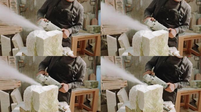 SLO MO男雕塑家使用角磨机使雕塑表面均匀