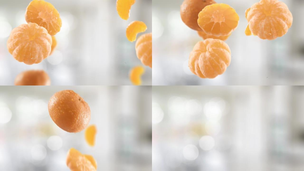 橘子和切片在厨房背景中的飞行