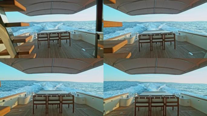 背景中的SLO MO一个餐桌椅和一个从游艇上醒来的东西