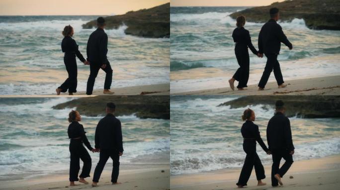 恋爱中的非洲民族浪漫情侣。阳光明媚的日子牵着手在海滩上浪漫散步