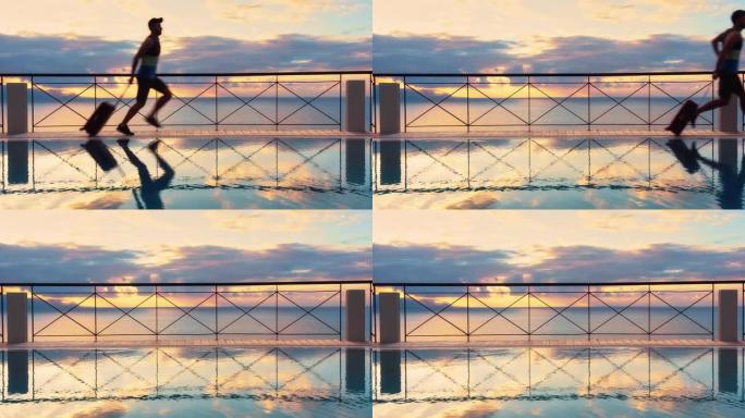 露台上的无边泳池。男人带着手提箱到达度假别墅