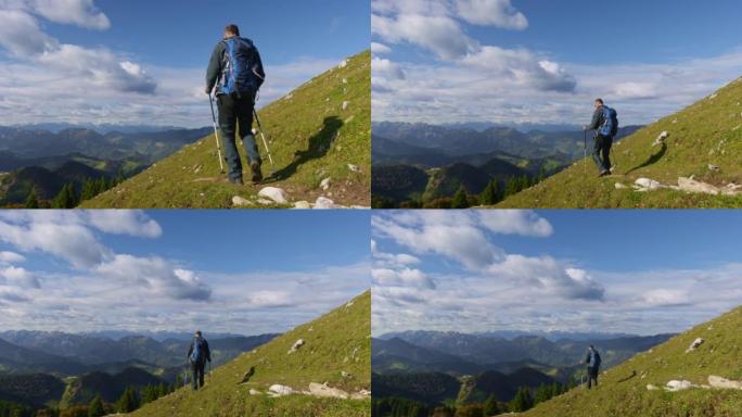 高级男性徒步旅行者在阳光下的风景优美的小径上下山