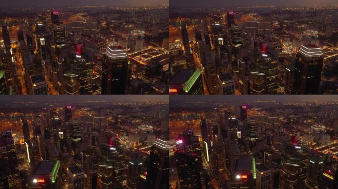 日落时间照明飞行在新加坡市中心屋顶空中全景4k