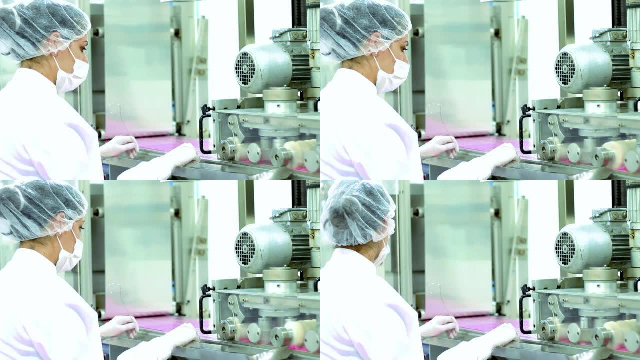 制药行业女工监督泡罩包装灌装过程-药丸制造