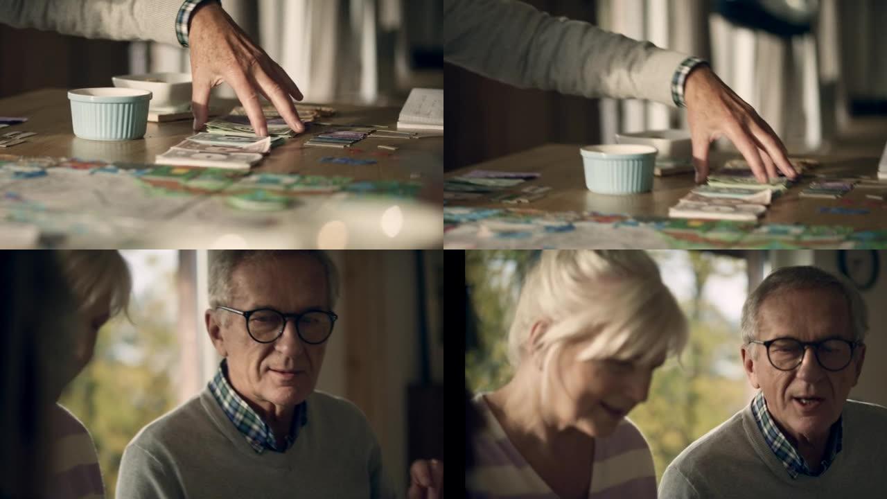 多元化的家庭与年迈的祖父母一起在桌子上玩棋盘游戏