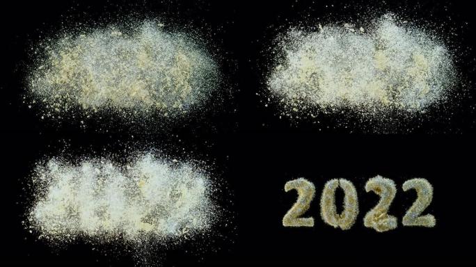 SLO MO LD金色灰尘落在黑色表面上，并创建数字 “2022”