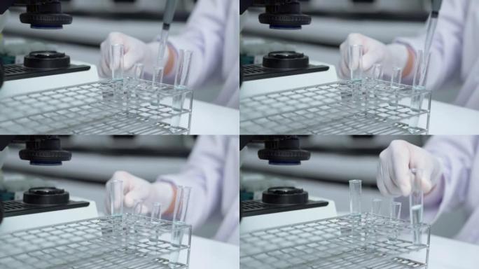 实验室技术员在显微镜室研究和开发抗病毒药物。