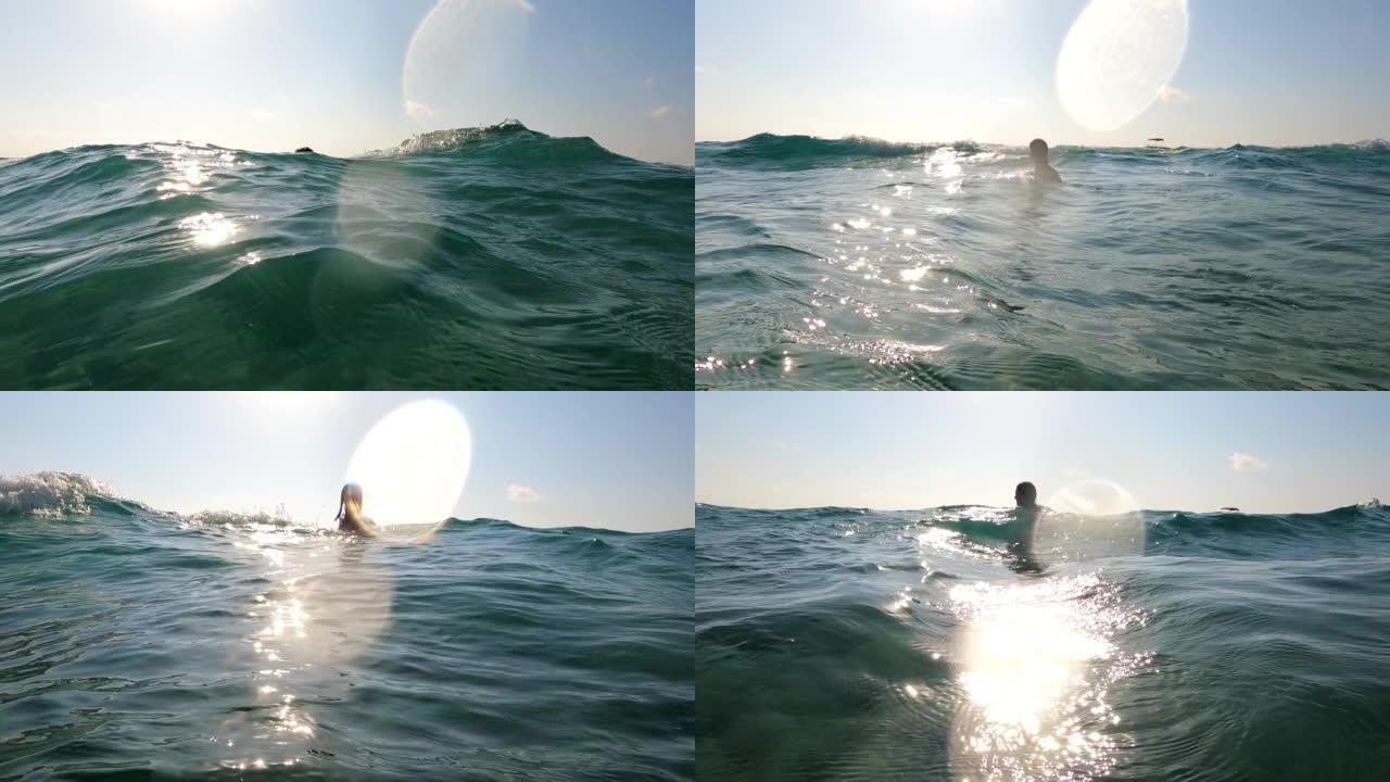喜欢在蓝色热带海洋游泳的女人。用相机调情