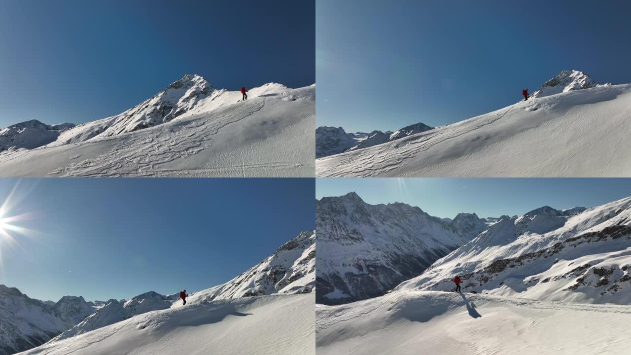 空中无人机拍摄了滑雪者在雪山上徒步旅行的镜头