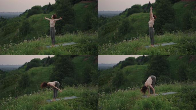 女人在松林日出时练习瑜伽。年轻灵性女孩的剪影在荷花中冥想在户外，慢动作。健身理念，健康生活方式