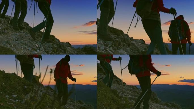 SLO MO徒步旅行者在黄昏时在陡峭的岩石斜坡上下山