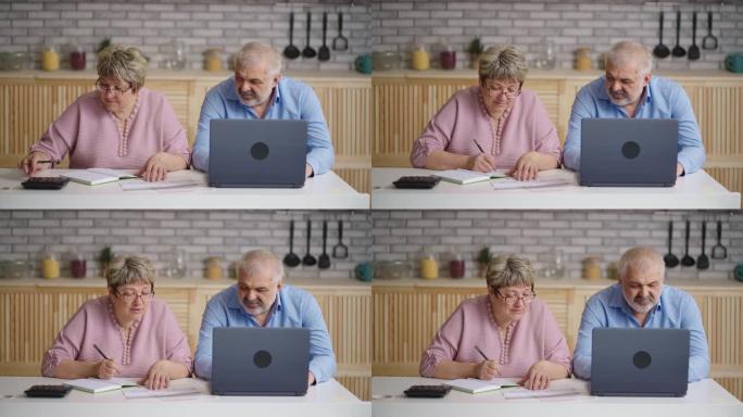 老人和女人在网上付款，妻子在计算水电费，丈夫在用笔记本电脑汇款