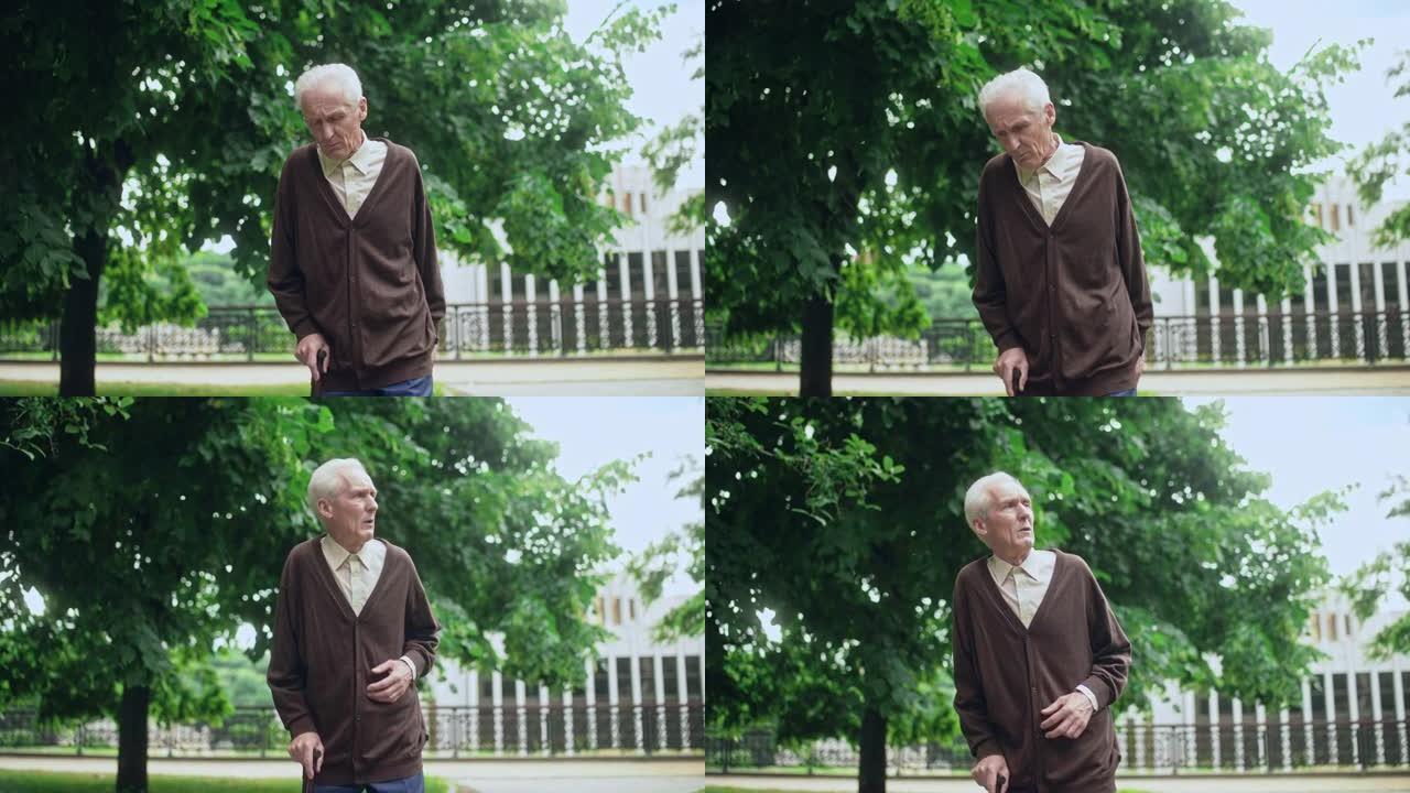 老人倚着拐杖在公园慢慢行走，感到孤独，康复