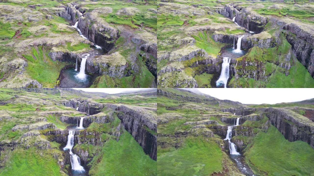 壮观的Klifbrekkufossar瀑布从冰岛东部mj ã ³ ifj ã r ã ur峡湾郁郁葱