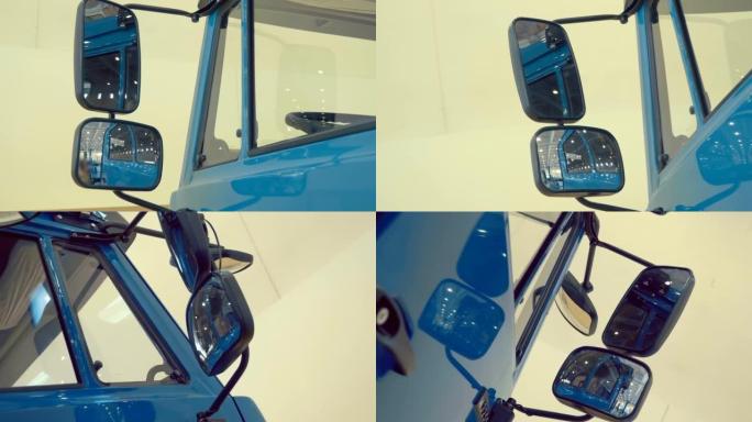 新型蓝色卡车驾驶室上的双后视镜。运动中的镜头
